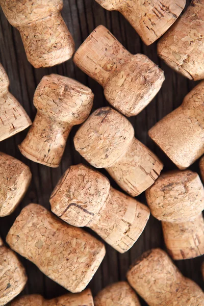 Dated wine bottle corks on the wooden background — Stock Photo, Image