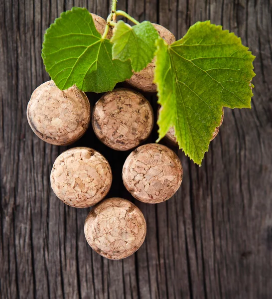 Dated wine bottle corks on the wooden background — Stock Photo, Image
