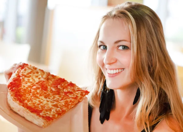 Portrait of young smiling woman with pizza — Stock Photo, Image