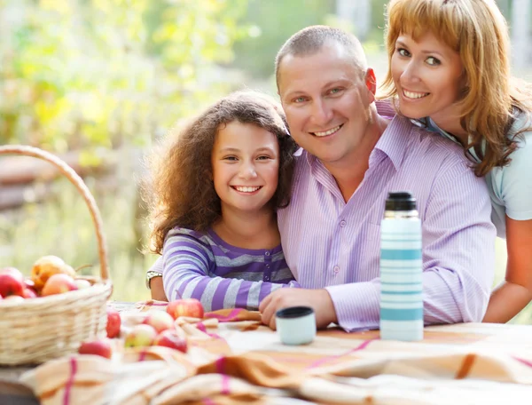 Happy young family outdoors — Stock Photo, Image