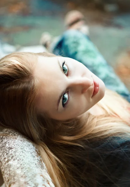 Young blond girl in autumn park in the evening — Stock Photo, Image