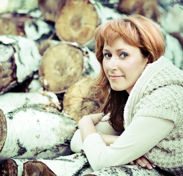 Portrait of a smiling red haired woman in autumn day — Stock Photo, Image