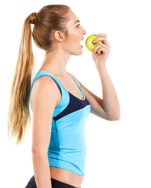 Fitness žena spokojený úsměv, drží zelené jablko — Stock fotografie