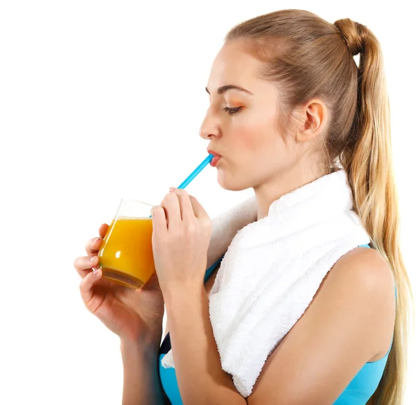 Attractive sporty woman with orange juice — Stock Photo, Image