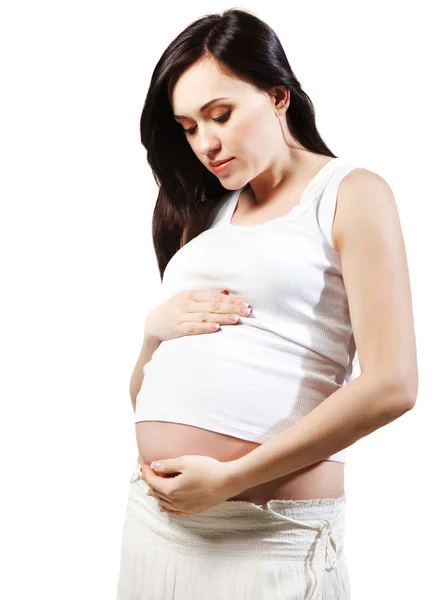 Happy young pregnant woman in white. Isolated Stock Image