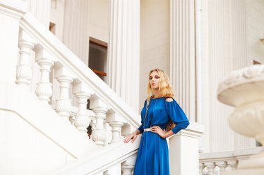 Beautiful blond woman outdoors on the stairs