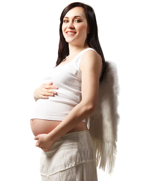 Счастливая беременная женщина в белом. Изолированные на белом — стоковое фото