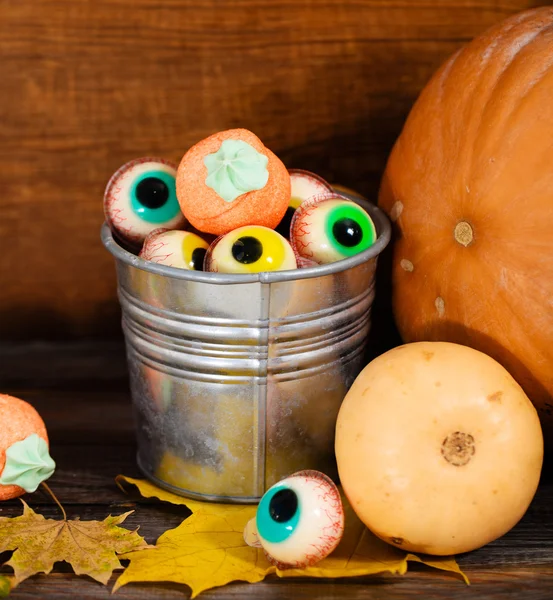 Halloween sweets, autumn leaves and pumpkins Stock Image