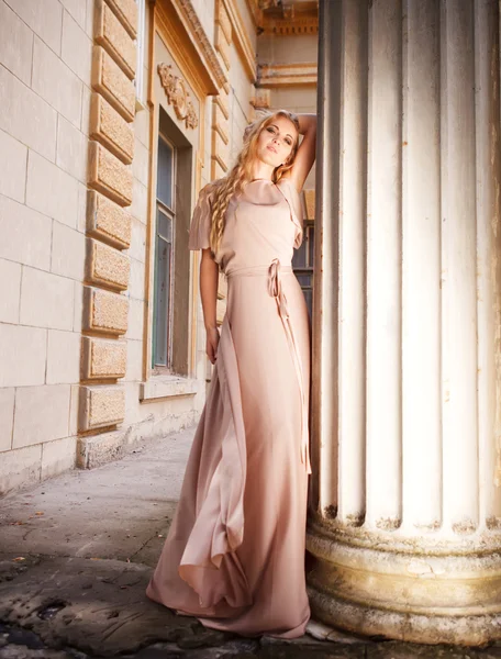 Beautiful blond woman in long dress outdoors — Stockfoto