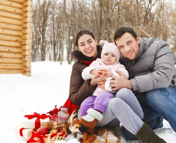 Happy smiling family with at the winter picnic — Stock Photo, Image