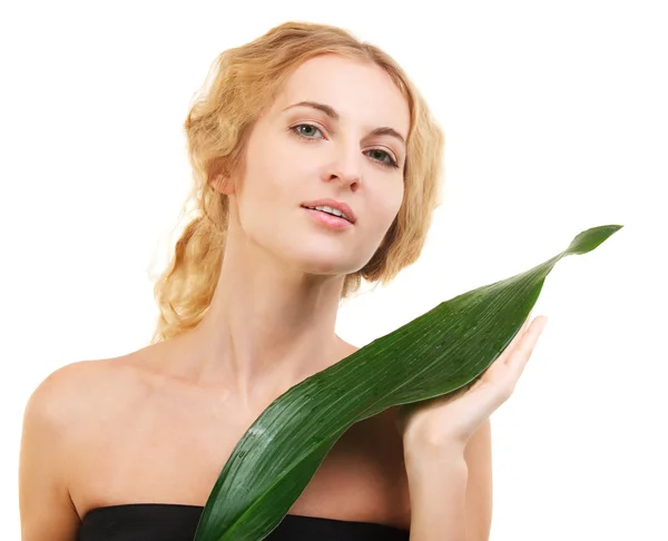 Portrait of the beauty young blond woman with green leaf — Stock Photo, Image