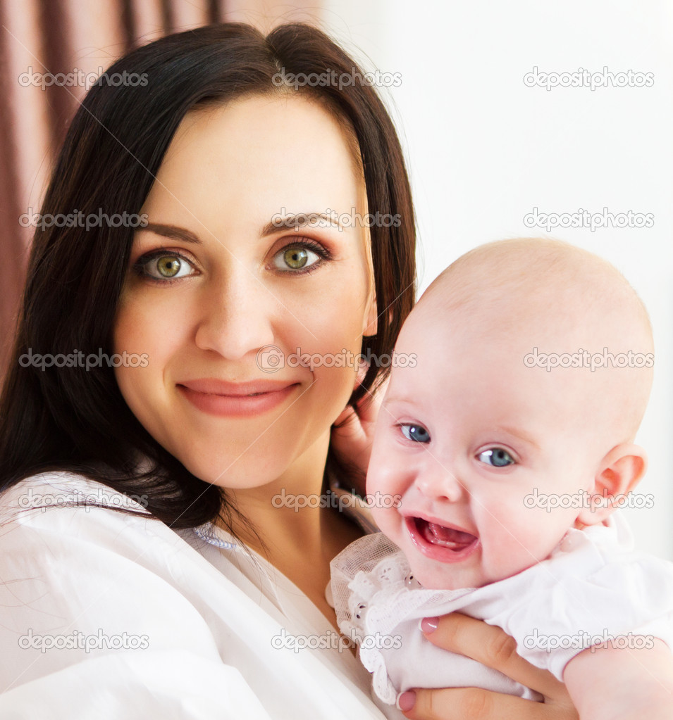 Happy smiling mother with six month old baby girl — Stock Photo