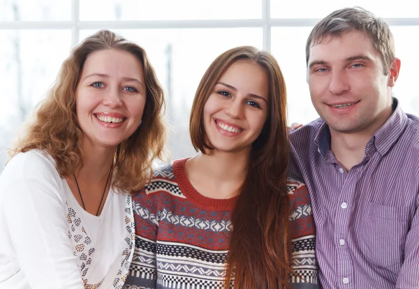 Smiling happy family with teenage daughter — Stock Photo, Image