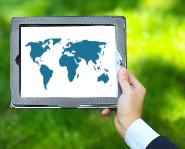 Man holding tablet computer with world map — Stock Photo, Image