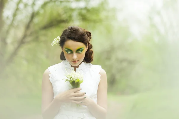 Portrait of a young girl lily of the valley — Stock Photo, Image