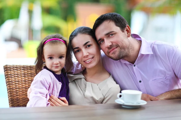 Family with baby girl in the cafe — Stock Photo, Image