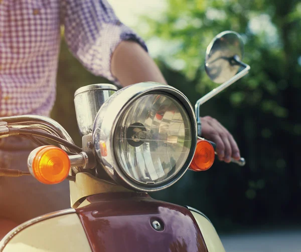 Young man riding old retro scooter — Stock Photo, Image