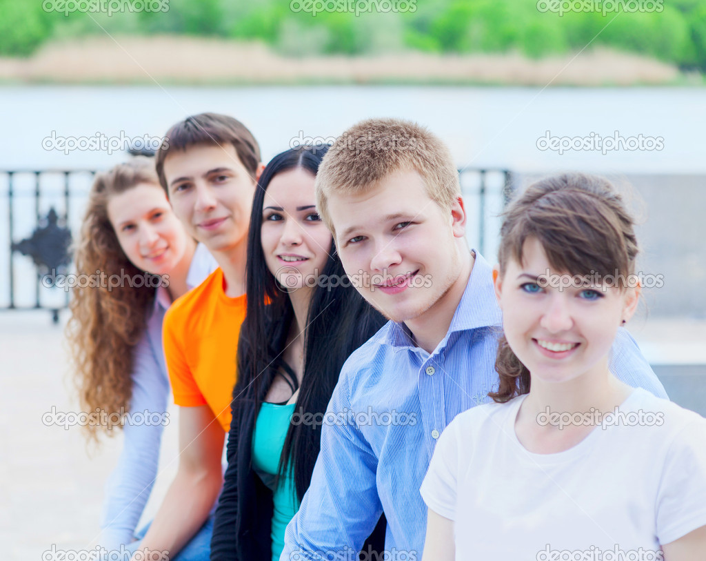 Group of smiling teenagers outdoors