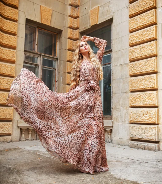 Beautiful blond woman in long dress outdoors — Stok fotoğraf