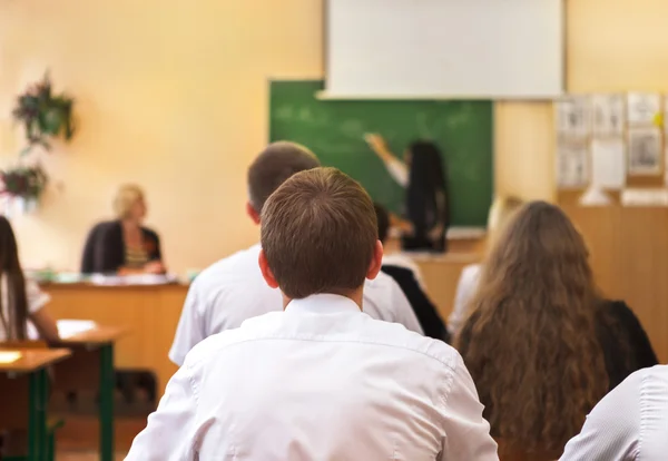 Rear view of students in the classroom — Stock Photo, Image