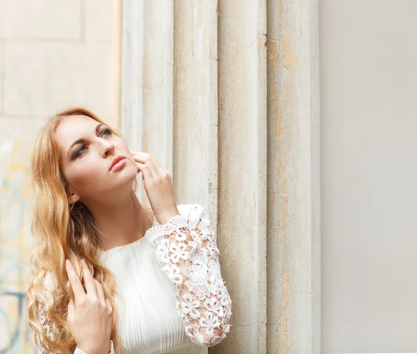Beautiful blond woman in beige dress outdoors — Stock Photo, Image