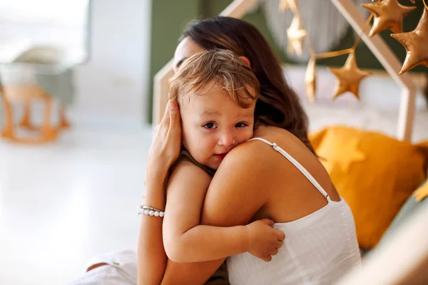 Young Woman Mother Expressing Love Little Baby Sitting Bed Sleeping — Stockfoto