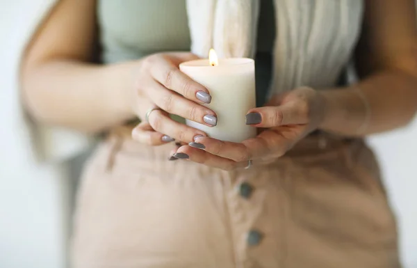 Side Portrait Young Calm Woman Holding Lit Candle Hands Closing — Foto Stock