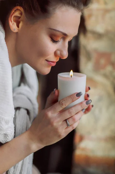 Side Portrait Young Calm Woman Holding Lit Candle Hands Closing — Stockfoto