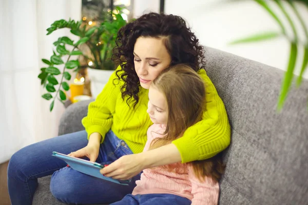 Mother Little Girl Daughter Watching Cartoons Digital Tablet While Sitting — Stock Photo, Image