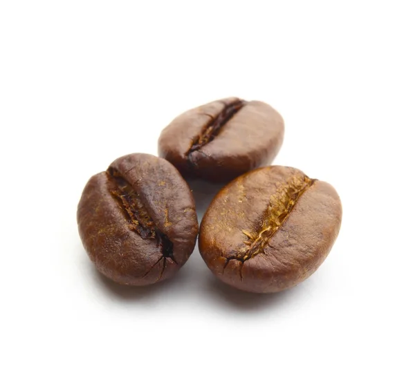 Macro shot of three coffee beans on white background — Stock Photo, Image