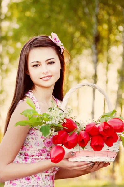 Beautiful girl with tulips outdoor — Stock Photo, Image