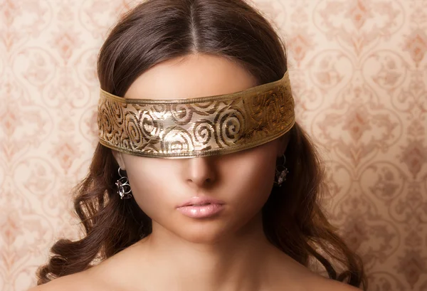 Mysterious beautiful face with ribbon on eyes — Stock Photo, Image