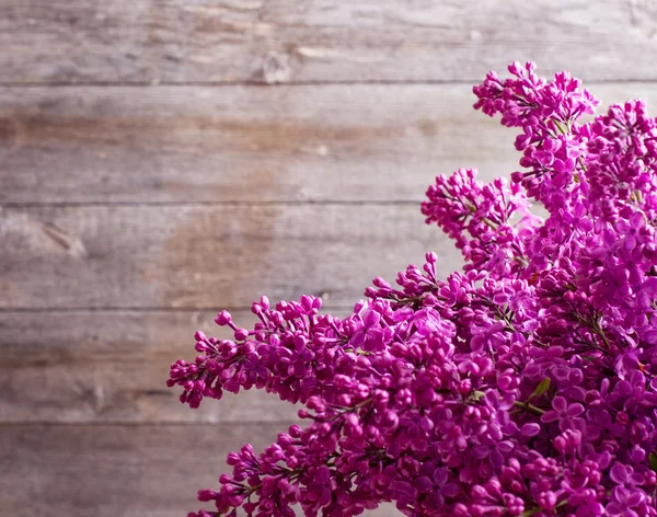 Lilac on wooden background — Stock Photo, Image