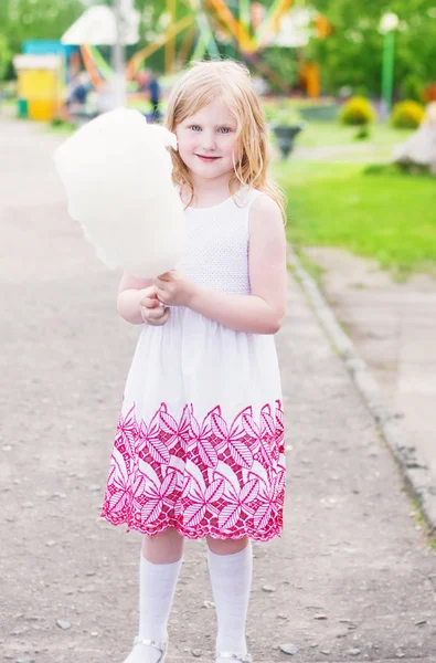 Little girl with cotton candy — Stock Photo, Image