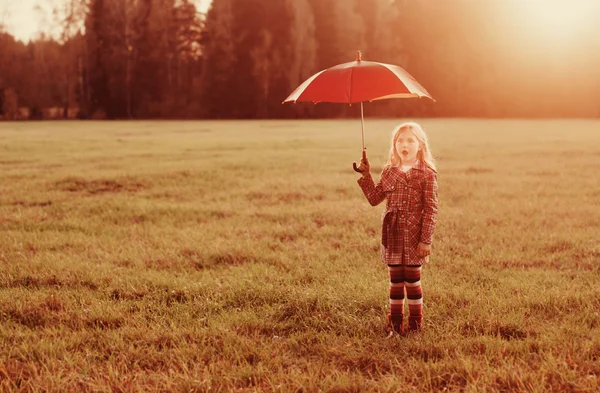 Little girl with umbrella outdoor — Stock Photo, Image