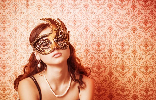 Beautiful Girl in a Carnival mask Stock Picture