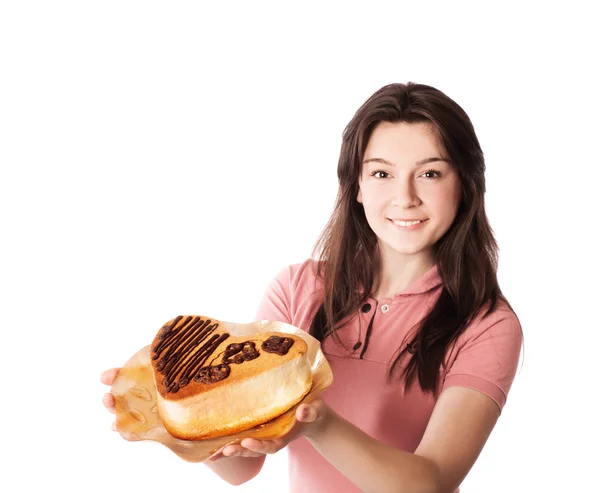 Glimlach meisje met cake geïsoleerd op wit Stockfoto