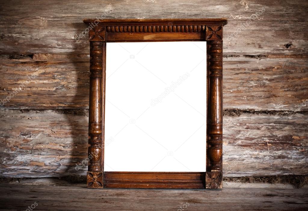 Old frame on wooden background