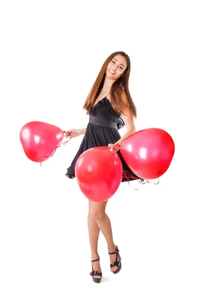 Schönes Mädchen mit rotem Ballon in Herzform — Stockfoto