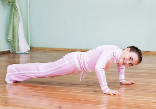 Girl exercising indoor — Stock Photo, Image