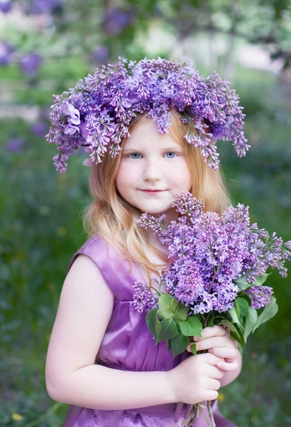 Beautiful girl with lilac flowers — Stock Photo, Image