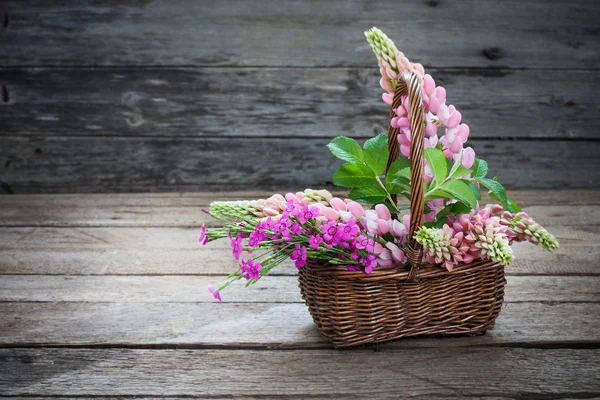 Flowers on wooden background — Stock Photo, Image