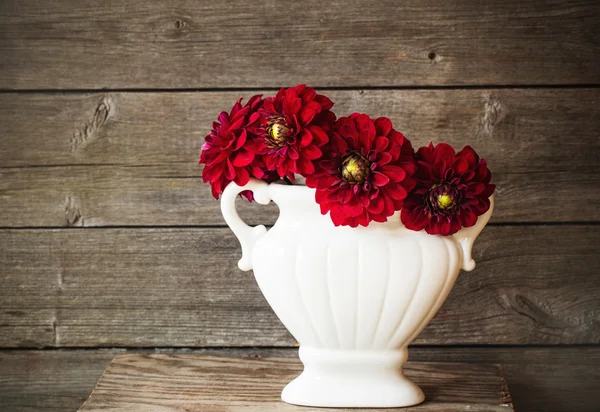 Flowers on wooden background — Stock Photo, Image