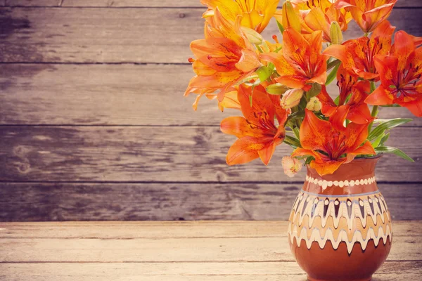 Flowers on wooden background — Stock Photo, Image