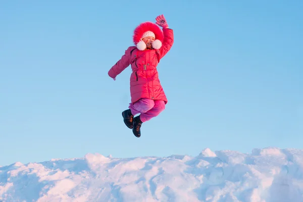 Happy girl on background snow and sky — Stock Photo, Image