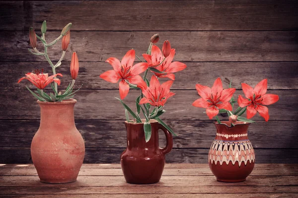 Orange lily on wooden background — Stock Photo, Image