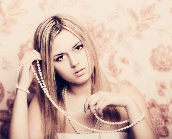 Beautifu blonde woman with pearl beads Stock Photo