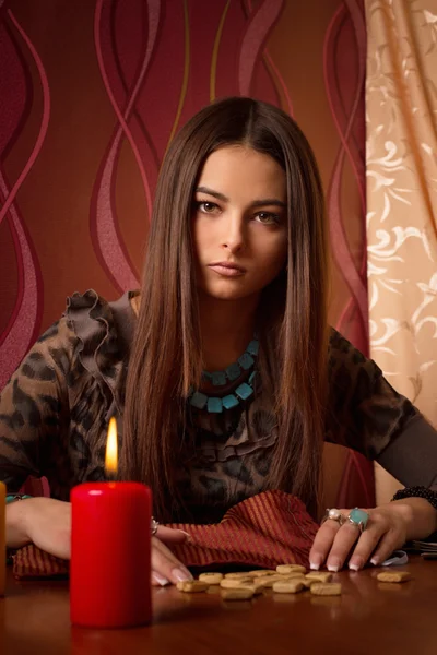 Young woman with wooden runes — Stock Photo, Image