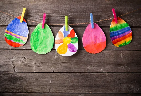 Child's drawing of Easter eggs on wooden background — Stock Photo, Image