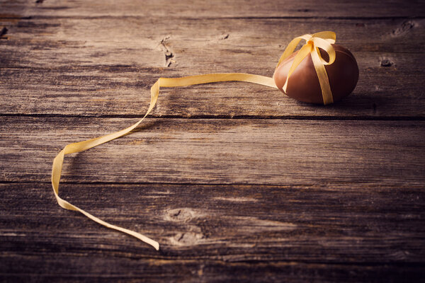 Chocolate Easter Eggs Over Wooden Background